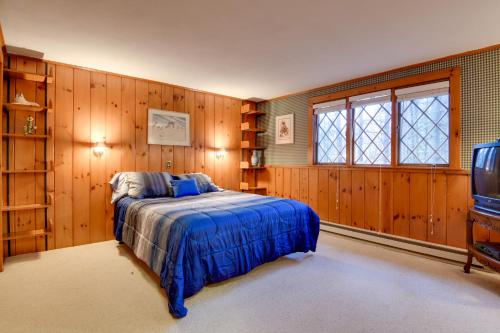 a bedroom with a bed and a tv in it at North Conway Home Less Than Walk to Slopes at Cranmore! in North Conway