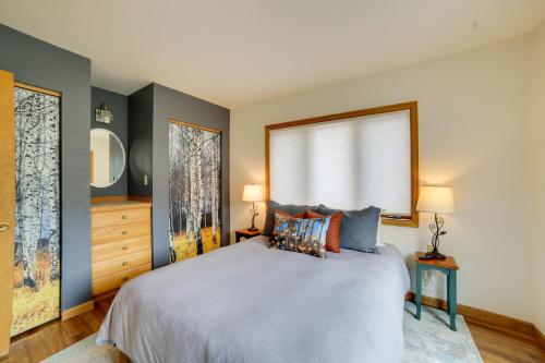 a bedroom with a large bed and a window at Mountain-View Apt - 6 Mi to Ouray Hot Springs! in Ridgway
