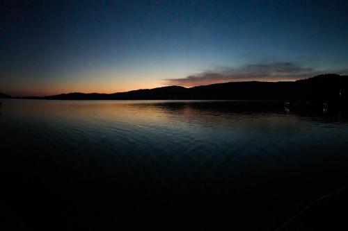 a large body of water with the sunset in the background at Sunset Cove in Maynardville
