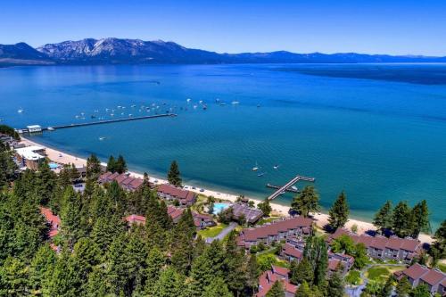 an aerial view of a beach with boats in the water at Lakeland Village 406 - The Lake Escape in South Lake Tahoe