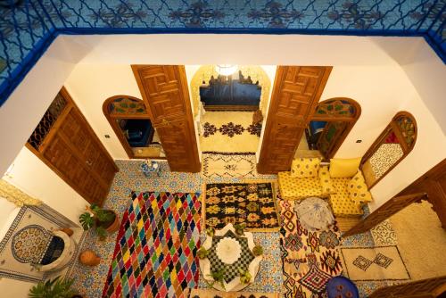 an overhead view of a living room with colorful carpet at Dar Ribati in Sale