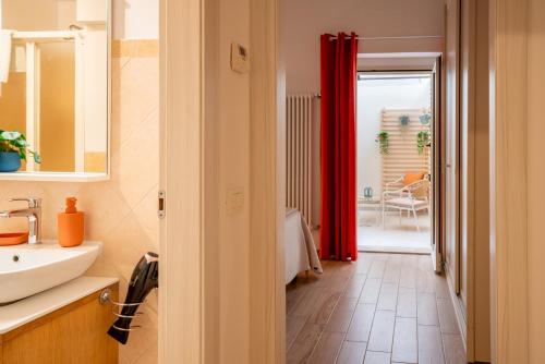 a bathroom with a sink and a mirror at Dante95 in Polignano a Mare