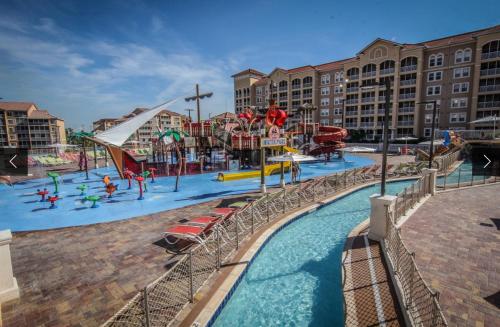 a water park with a water slide and slides at Westgate town center resort in Orlando