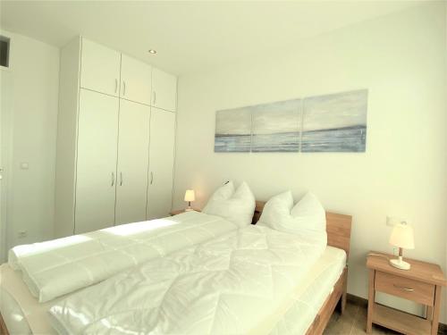 Postel nebo postele na pokoji v ubytování Ferienwohnung Fiete, Am Alten Deich 4-6, Whg 1 22