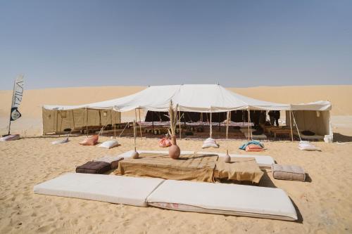 a tent on the sand in the desert at Tzila Camp in Fayoum Center
