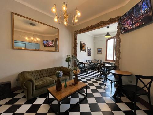 a living room with a couch and a table at Hotel Casa Aure in Santiago