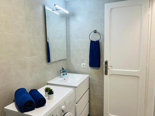 a bathroom with a sink and a mirror at -MONTORIAN Apartments -LANZAROTE in Tías