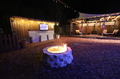 a small candle in the middle of a yard at night at 3 Bdrms & Private Backyard Tiki Courtyard & more in Homosassa Springs