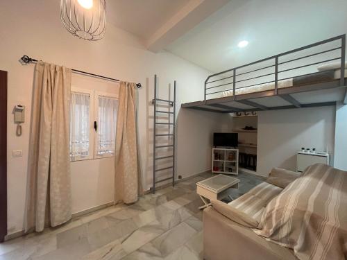 En eller flere senge i et værelse på RgHOST-Apartamento La Palma en Casco Histórico