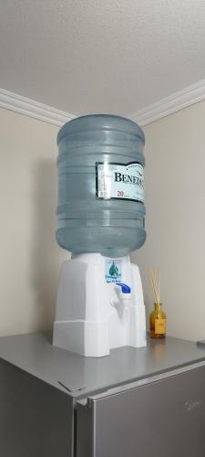 a blue container sitting on top of a kitchen appliance at Cómodo y acogedor departamento in Antofagasta