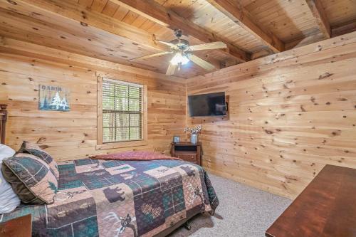 a bedroom with a bed and a ceiling fan at Mountain Bliss in Townsend