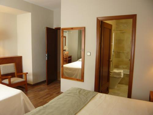 Posteľ alebo postele v izbe v ubytovaní Hotel Sierra Las Villas