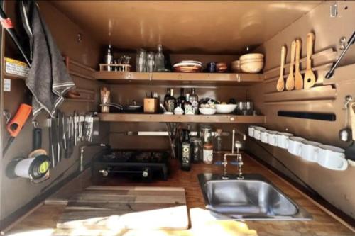 a kitchen with a sink and a counter with utensils at Paradise Ranch Inn - Mindful Tent in Three Rivers
