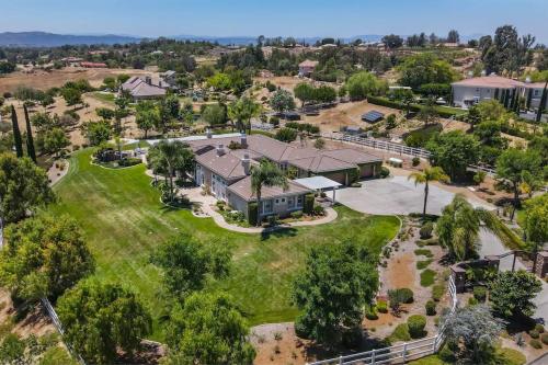 an aerial view of a large house with a yard at Temecula Wine Country Villa in Temecula