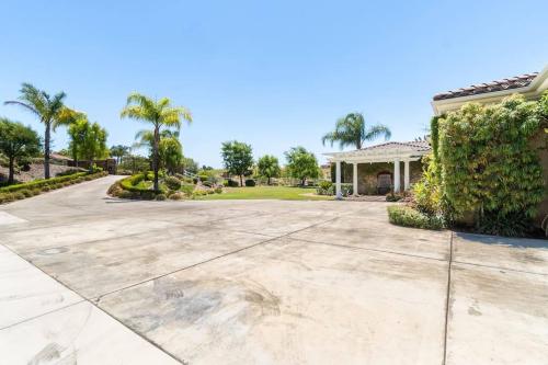 an empty driveway in front of a house at Temecula Wine Country Villa in Temecula