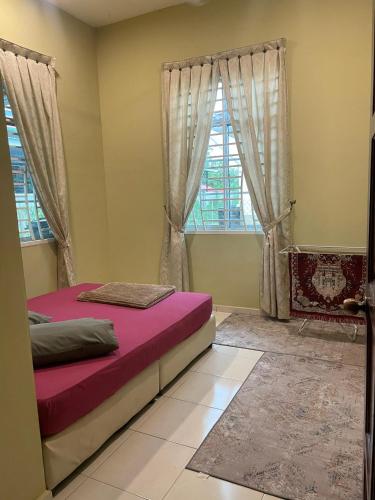 a bedroom with a bed and a window at TDH Homestay Arau FREE Wifi in Arau