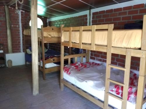 a group of bunk beds in a room at Finca el pinar in Huaraz