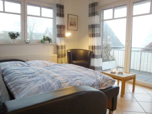 Кровать или кровати в номере Haus Tante Clara Seglerkoje, Whg 6, Kukshörner Weg 8a