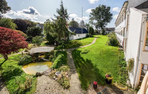 an aerial view of a garden with a pond at Stunning Apartment In Stavanger With Kitchen in Stavanger