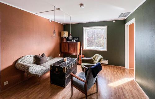 a living room with a couch and two chairs at Stunning Apartment In Stavanger With Kitchen in Stavanger