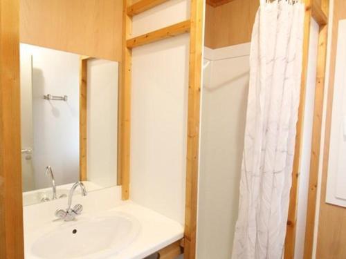 a bathroom with a sink and a mirror at Gîte Salers, 3 pièces, 4 personnes - FR-1-742-439 in Salers