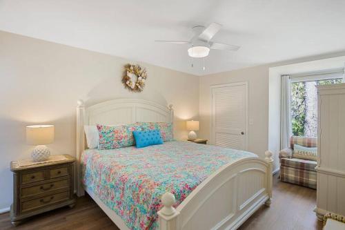 a bedroom with a bed and a ceiling fan at 1316 Pelican Watch Villas Seabrook Island SC in Seabrook Island