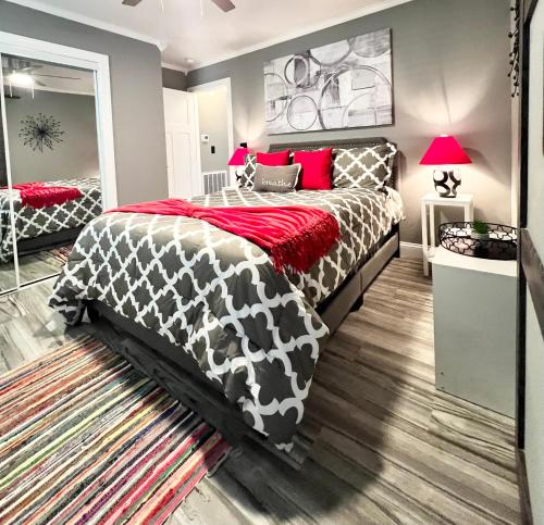 a bedroom with a bed with a black and white comforter at *The Gemstone* Newly Renovated, Stylish, Spacious in Ladson