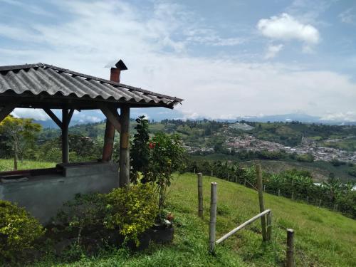a small house on a hill with a view at finca lusitania in Marsella