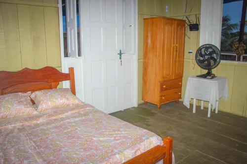 En eller flere senge i et værelse på Nossa Casa de Praia