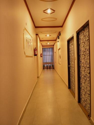 a corridor in a building with at Light House By Leisure Hospitality in Rishīkesh