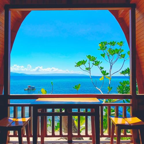 a view of the ocean from a resort balcony at Bunaken 18 Diving Resort and Cafe in Bunaken