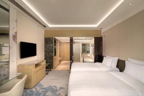 Ένα ή περισσότερα κρεβάτια σε δωμάτιο στο Kempinski Hotel Beijing Yansha Center
