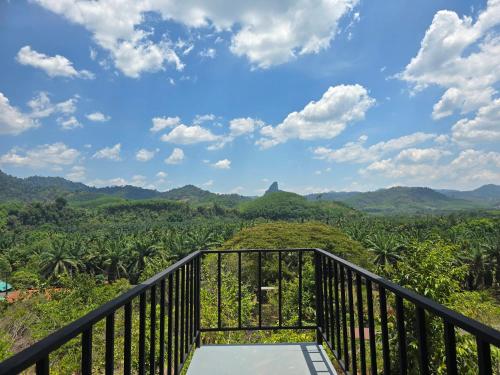 a balcony with a view of a jungle at Khao Sok Horizon in Ban Bang Thong