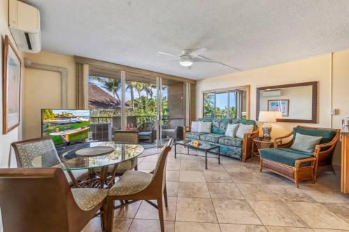 a living room with a couch and a table at Nani Kai Hale 208- Beachfront 1 bedroom 2 bathroom condo, oceanview in Kihei