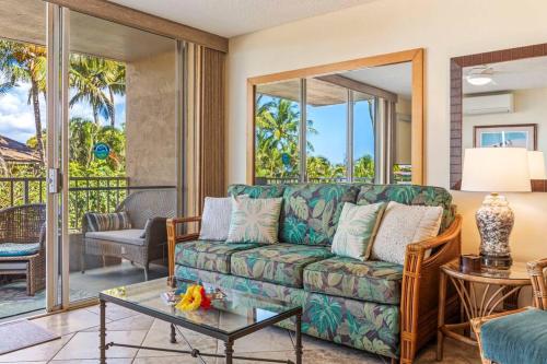 a living room with a couch and a table at Nani Kai Hale 208- Beachfront 1 bedroom 2 bathroom condo, oceanview in Kihei