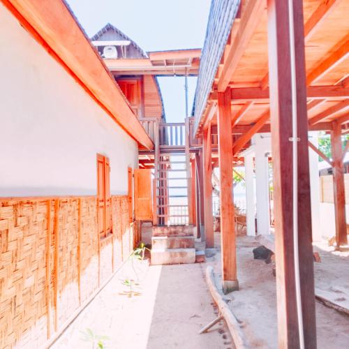 a house under construction with wooden beams at Bunaken 18 Diving Resort and Cafe in Bunaken