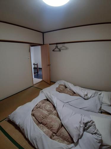 Postel nebo postele na pokoji v ubytování guest house komoriya