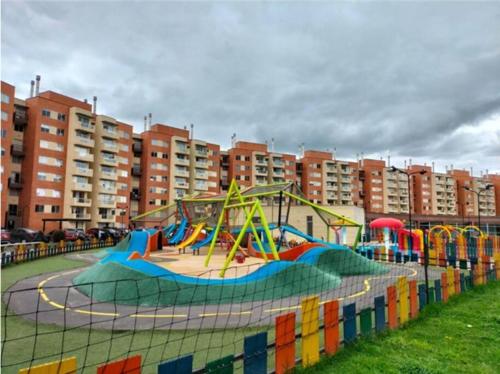 a playground with a slide in a park at La mejor habitacion privada del sector in Mosquera