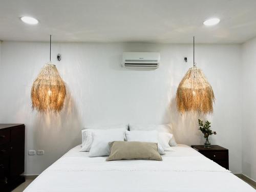 Кровать или кровати в номере Casa campestre con piscina cerca al aeropuerto y la playa