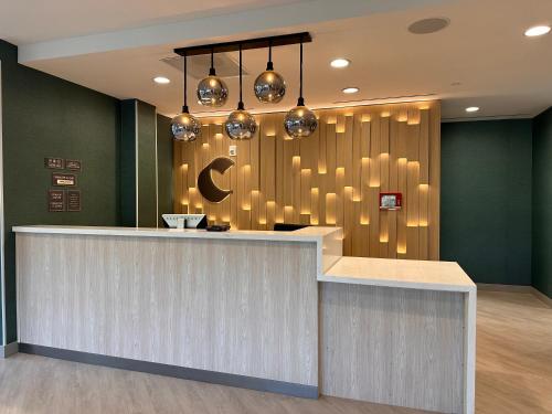 a lobby with a bar with lights on the wall at Comfort Suites Gatlinburg Downtown-Convention Center in Gatlinburg
