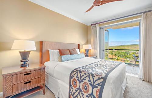 a bedroom with a bed and a window with a view at KBM Resorts: Honua Kai HKK-820 Includes Rental Car in Kaanapali