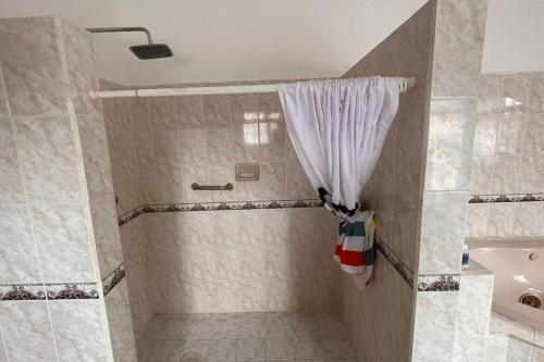 a bathroom with a shower with a shower curtain at casa completa en Villahermosa in Villahermosa