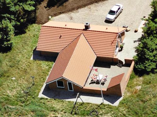 an overhead view of a house with a car parked next to it at 8 person holiday home in Harbo re in Harboør