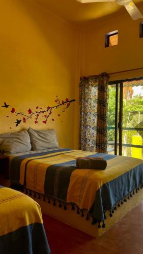 Postel nebo postele na pokoji v ubytování Casa Colibri La Punta