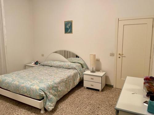เตียงในห้องที่ Rimini Holiday Apartment