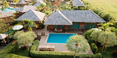 an aerial view of a house with a swimming pool at Tongna Cottage Natural Resort in Chiang Mai