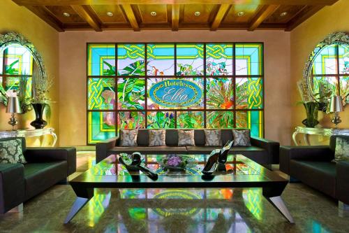 a living room with a stained glass window at Elba Costa Ballena Beach & Thalasso Resort in Costa Ballena