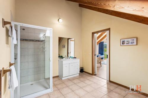 a bathroom with a shower and a sink at Charming 3-Bedroom Retreat in Cowes