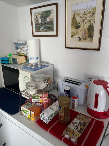 a kitchen counter top with food and appliances on it at Villa Borostyán in Tihany