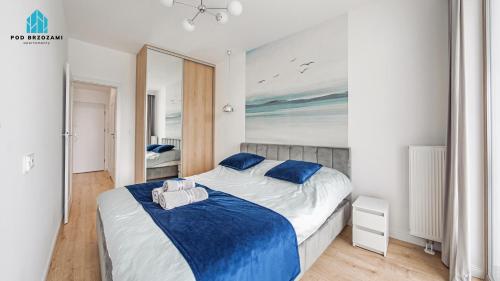 Postel nebo postele na pokoji v ubytování Pod Brzozami Apartamenty Gea Eco